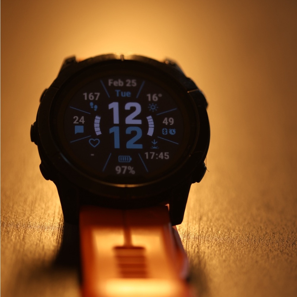 Garmin Orange Smartwatch with Rugged Design and Digital Display